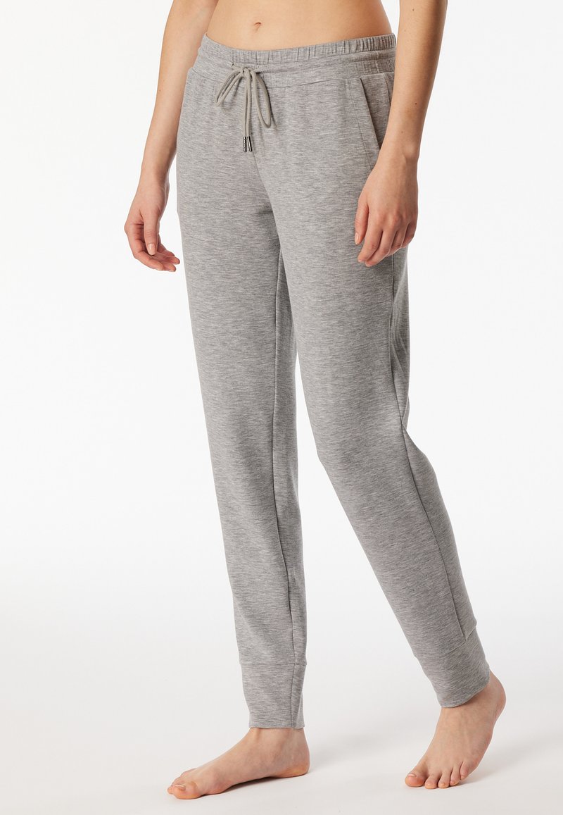 Gray jogger pants made of soft fabric, featuring an elastic waistband with drawstring, side pockets, and tapered legs.