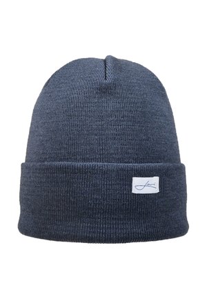 Navy knitted beanie with a folded cuff, featuring a small white label with a logo. The material appears soft and textured.