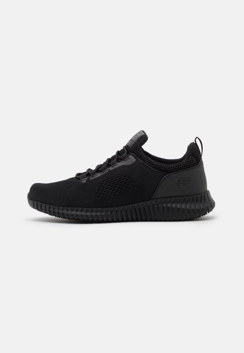 Black athletic shoe with a breathable mesh upper, textured rubber sole, lace-up design, and a pull tab at the heel for easy wear.