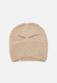 Beige ribbed knit beanie made from soft material, featuring a rounded top and a folded cuff at the base. Simple and textured design.