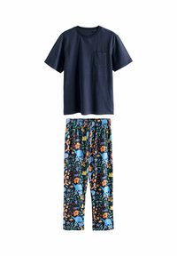Marineblaues Kurzarmhemd mit Brusttasche, kombiniert mit schwarzen Hosen, die farbenfrohe Blumen- und blaue Elefantenmuster aufweisen.