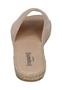 Beige espadrille sandal with a soft fabric upper, open back, and a woven jute sole. Smooth insole with printed brand name and logo.