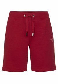 Red cotton shorts with a drawstring waist, silver eyelets, and a small logo detail on the side. Smooth texture, mid-thigh length.