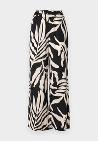 Black and white wide-leg pants featuring a leaf pattern, elastic waistband, and soft fabric texture.