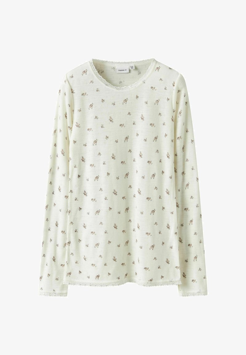 Długi rękaw bluzka z miękkiego jasnego zielonego materiału, z kwiatowym wzorem w brązie. Teksturowane wykończenie z koronkowym wykończeniem przy dekolcie i dolnym brzegu.