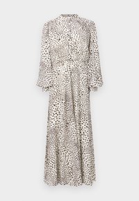 Robe midi à manches longues, boutonnée, avec un col montant et des pois marron irréguliers sur fond blanc.