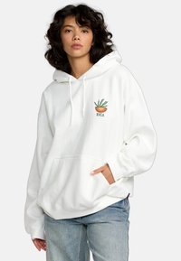 Witte oversized hoodie met een voorzak, voorzien van een kleurrijke plantgraphic en de tekst "RVCA". Zacht materiaal met een ontspannen pasvorm.
