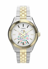 Silver and gold-tone metal watch with a floral design on a white face and gold ridged bezel. Features black hour markers and a textured bracelet.