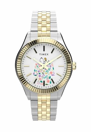 Montre en métal argenté et doré avec un motif floral sur un cadran blanc et une lunette dorée striée. Comprend des marqueurs d'heure noirs et un bracelet texturé.