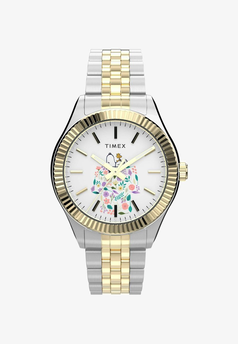 Silver and gold-tone metal watch with a floral design on a white face and gold ridged bezel. Features black hour markers and a textured bracelet.