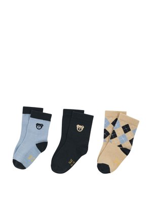 Drei Paar Kindersocken: ein hellblaues Paar mit schwarzem Bärengesicht, ein schwarzes Paar mit beigem Bärengesicht und ein beiges Paar mit blauem und schwarzem Argyle-Muster.