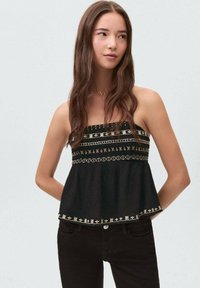 Black strapless top with textured fabric, featuring gold embroidered patterns along the bust and hem, flared silhouette, and a loose fit.
