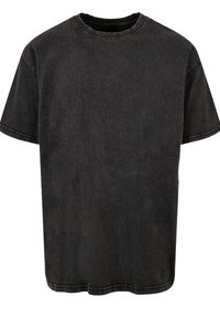 Zwarte denim T-shirt met een ronde hals, korte mouwen en rechte snit. Opvallend door de gestructureerde stof en zichtbare stiksels.