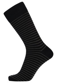 Sorte sokker med tynde vandrette guldstriber. Lavet af et blødt materiale, de har en forstærket tå og en ribbet kant for en sikker pasform.