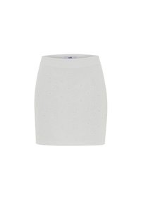 Jupe blanche avec un motif texturé et des découpes florales, design taille haute et silhouette ajustée. Finition du tissu propre et lisse.