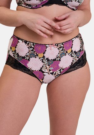 Culottes tailles hautes en imprimé floral avec des fleurs roses, violettes et jaunes sur un fond noir. Dentelle noire sur les côtés.