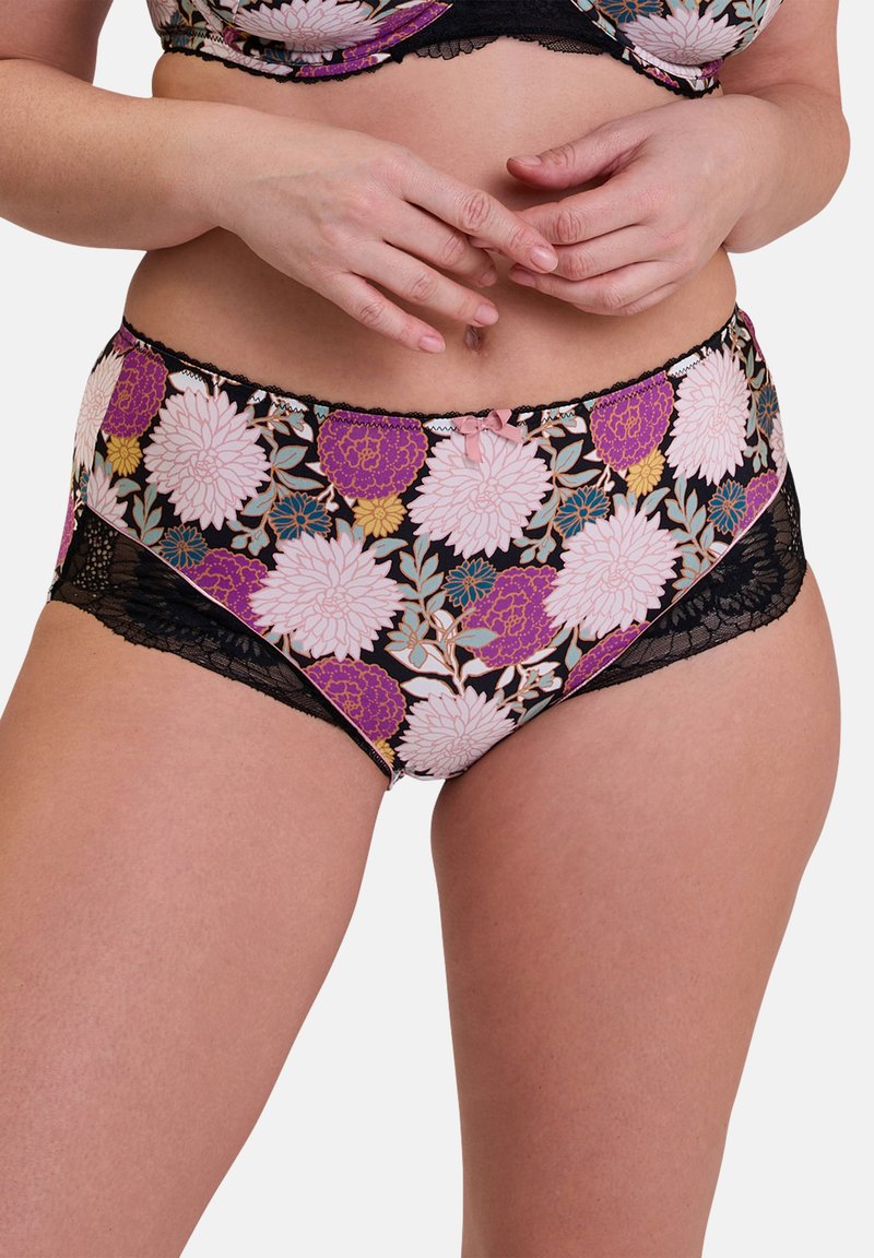 Culottes tailles hautes en imprimé floral avec des fleurs roses, violettes et jaunes sur un fond noir. Dentelle noire sur les côtés.