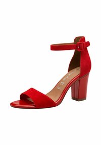 Red suede high-heeled sandal with an open toe, ankle strap with buckle, and a glossy red block heel. Smooth inner lining and minimal detailing.