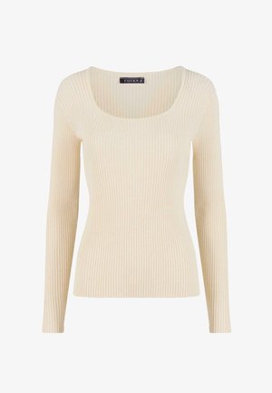 Světle béžový žebrovaný svetr s dlouhým rukávem, širokým výstřihem do véčka a přiléhavým střihem. Tkanina má měkký, texturovaný vzhled.