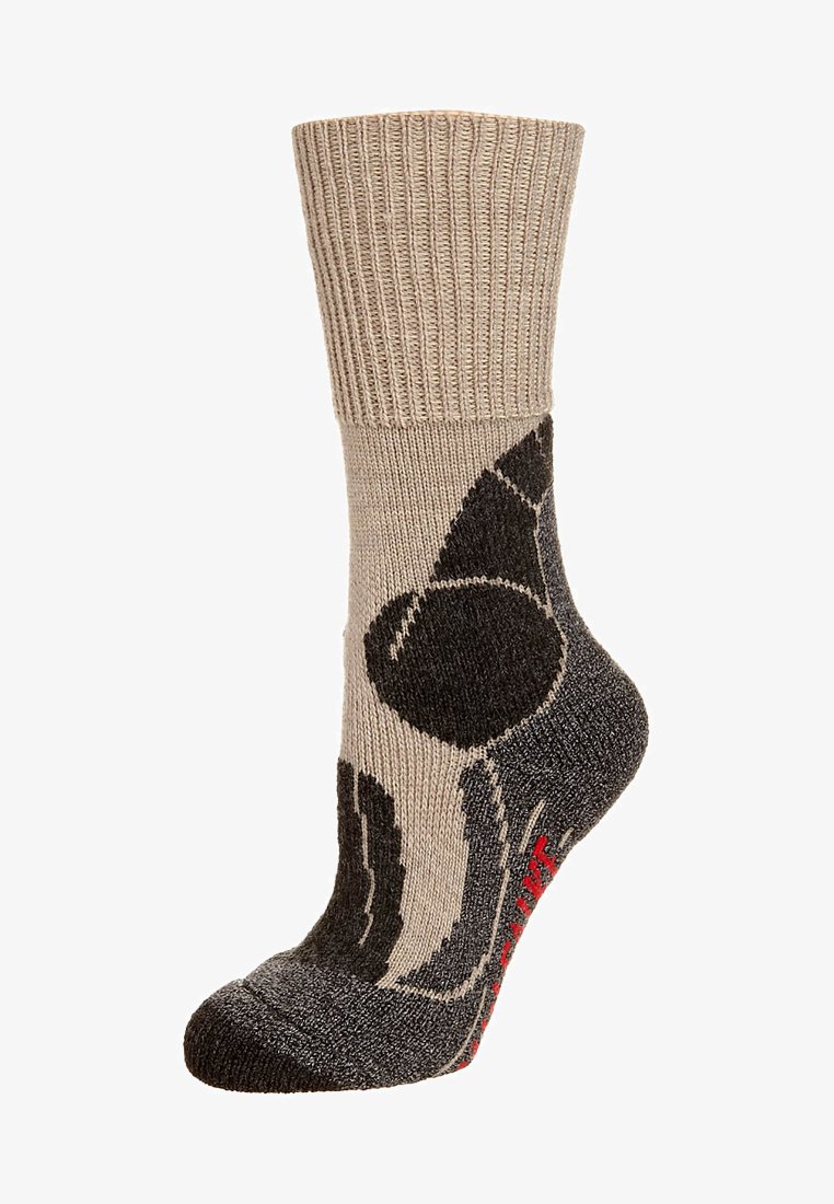Chaussette à motifs brun et gris avec un haut côtelé, présentant un grand design noir et un logo rouge. Fabriquée en matériau tricoté texturé.