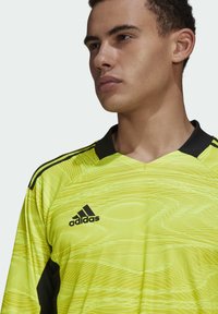 Yellow long-sleeve soccer jersey with a wave pattern, black accents, and a black collar. Features an embroidered black adidas logo.