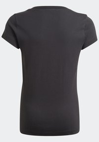 Camiseta corta de manga negra, con cuello redondo, vista desde la parte posterior sobre un fondo neutro.