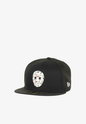 Black baseball cap with a flat brim, featuring a white mask design on the front, accented with red markings and black dots.