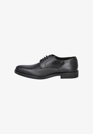 Zapato de vestir de cuero negro con puntera redondeada, diseño con cordones, textura suave y estética minimalista. Suela de goma con un pequeño tacón.