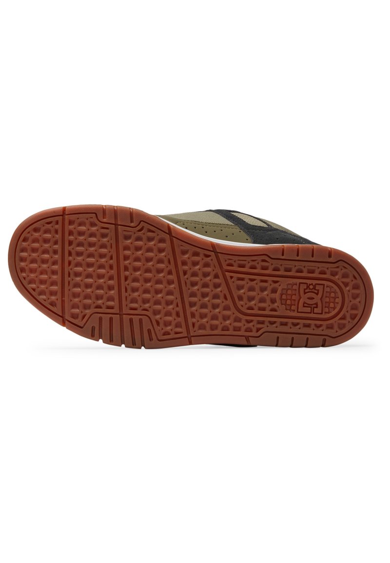 Schuhsohle mit einer gummierten braunen Unterseite, die ein strukturiertes Muster für den Grip aufweist und schwarze sowie khakifarbene Akzente an den Seiten hat.