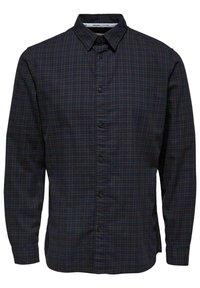 Camicia a maniche lunghe a quadri in navy scuro e verde, realizzata in cotone biologico. Presenta un colletto button-down e chiusura frontale con bottoni.