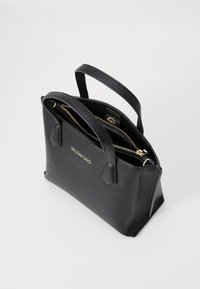 Black leather handbag with a textured surface and gold hardware. Features two top handles and a zippered compartment inside. Gold logo displayed.