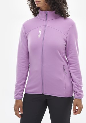 Veste en polaire zippée lavande avec col haut, poches latérales et texture à rayures discrètes. Présente un logo sur la poitrine gauche.