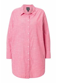 Camicia a maniche lunghe a righe rosse e bianche con bottone frontale e colletto. Realizzata in tessuto leggero, presenta una vestibilità rilassata.