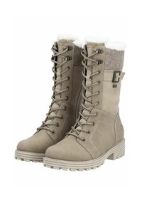 Beige waterdichte veterschoenen met een zachte bontvoering, bovenwerk van vilt, verstevigde oogjes en een gestructureerde rubberen zool voor grip.