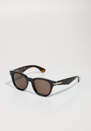 Tortoiseshell sunglasses with brown lenses, square frames, and gold-accented hinges. Smooth texture with a polished finish.