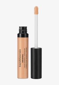 Vloeibare minerale concealer in een cilindervormige tube; perzikkleurig met een matte afwerking, zwarte dop en een wit applicatorstaafje.