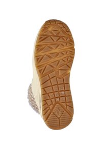 Gummiaußensohle mit einem strukturierten Grip-Muster, beige mit braunen Akzenten. Die Seite zeigt ein flauschiges Textilobermaterial, das ein gemütliches Aussehen bietet.