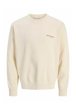 Kermansweater med långa ärmar, rund halsringning och ribbade manschetter. Har en liten brun logotyp på vänster bröst. Mjuk tygstruktur.