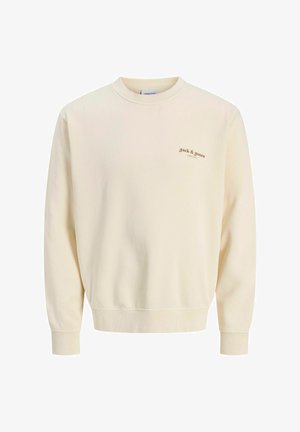 Krämfärgad sweatshirt med långa ärmar, rund halsringning och ribbade manschetter. Har en liten brun logotyp på vänster bröst. Mjuk tygtextur.