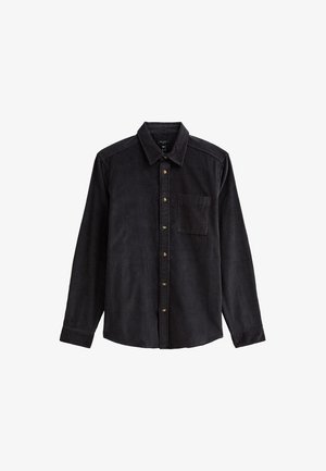 Black corduroy shirt with a button-down collar, long sleeves, and front pocket. Features vertical ribbing and gold buttons.
