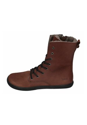 Brown leather ankle boots with black laces, soft lining, and a contrasting black rubber sole. Features metal eyelets and stitched accents.