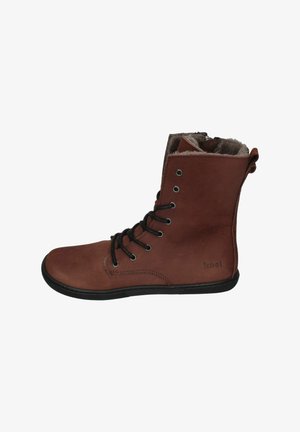 Brown leather ankle boots with black laces, soft lining, and a contrasting black rubber sole. Features metal eyelets and stitched accents.