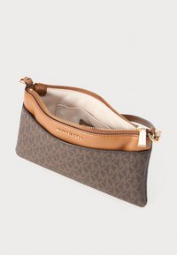 Brown patterned clutch made of canvas with a tan leather top. Features a gold zipper closure and logo detailing on the front.