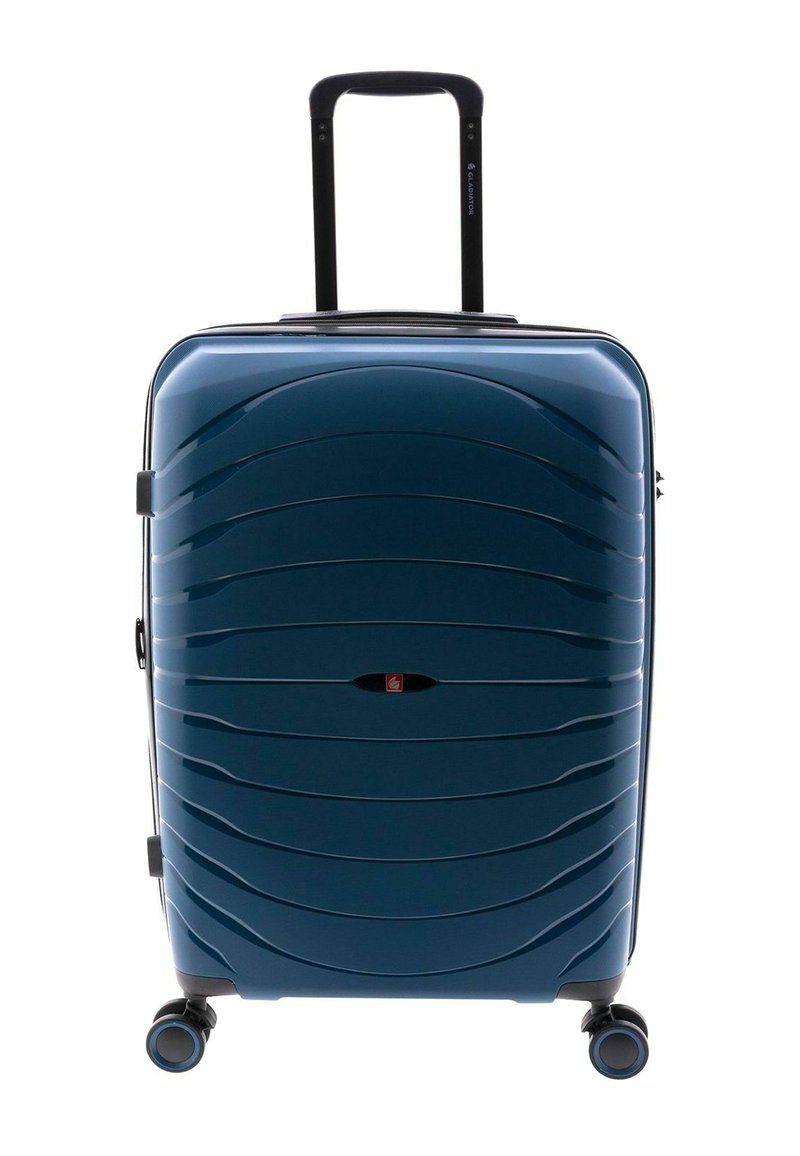 Maleta rígida de color azul oscuro con superficie con patrón de olas, asa retráctil y cuatro ruedas multidireccionales para facilitar la movilidad.