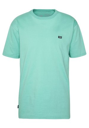 Mintgrøn bomulds t-shirt med rund hals, korte ærmer og et lille sort Vans logo-patch på venstre bryst. Glat tekstur.