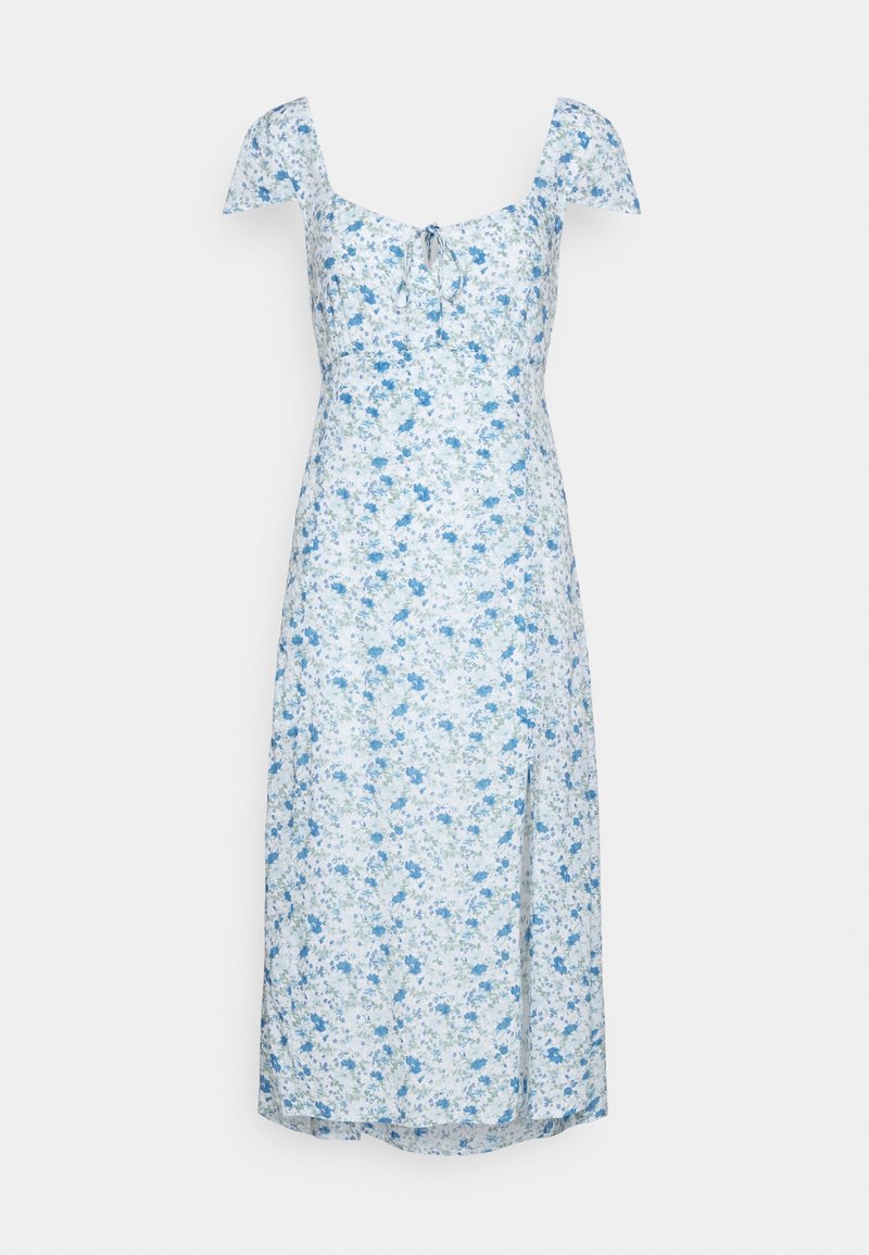 Robe midi bleu clair et blanche à motif floral, avec manches courtes bouffantes, encolure en cœur, détail noué et fente à l'avant.