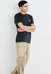 Lee Reisitaskuhousut - kansas city khaki