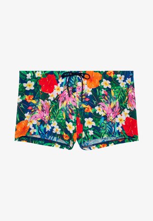 Costume da bagno da uomo con sfondo verde, vivace stampa floreale, uccelli tropicali multicolori e cintura con coulisse nera.