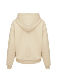 Svetlo béžová mikina s kapucňou, voľného strihu, s rebrovanými manžetami a lemom. Hladká textúra, minimalistický dizajn a žiadne viditeľné logo.
