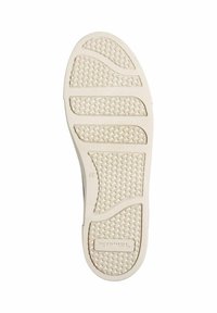 Suola di scarpa con un motivo testurizzato in gomma beige, caratterizzata da scanalature e onde per la presa, etichettata con il nome del marchio "Toms" e taglia 37.